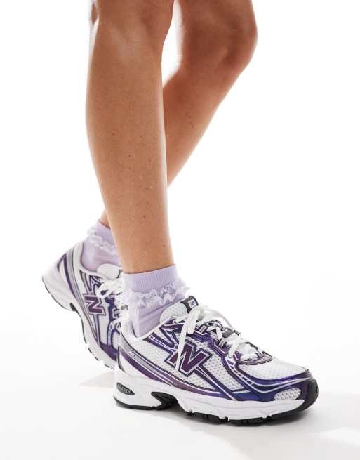 New Balance 740 sneakers in white and purple