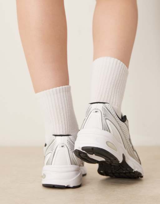 New Balance 740 sneakers in white and silver