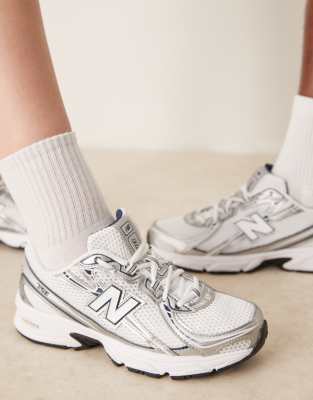 New Balance 740 sneakers in white and silver