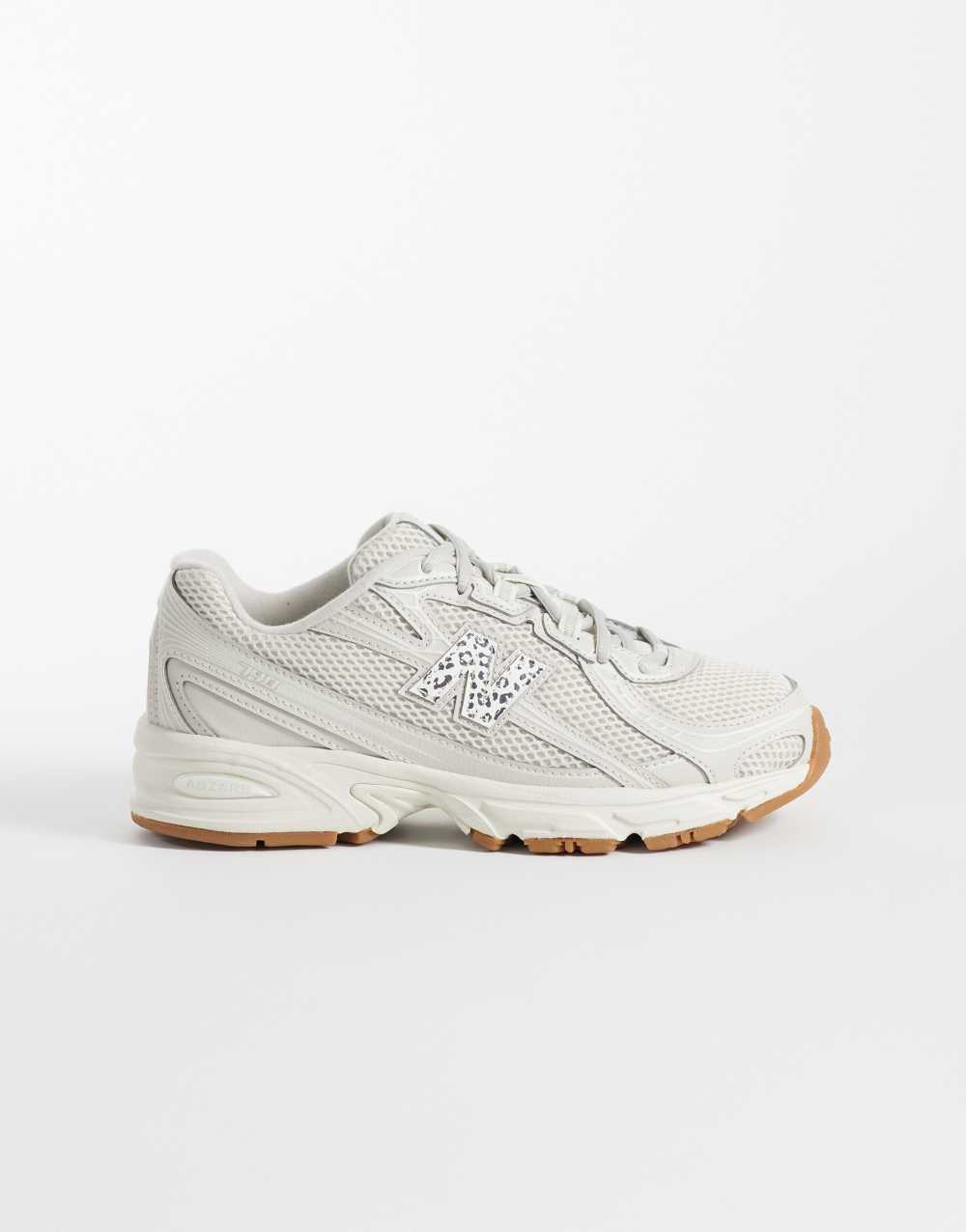 New Balance 740 trainers in off white and leopard print