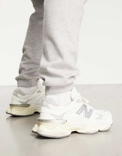 New Balance 9060 sneakers in white with gray metallic detail