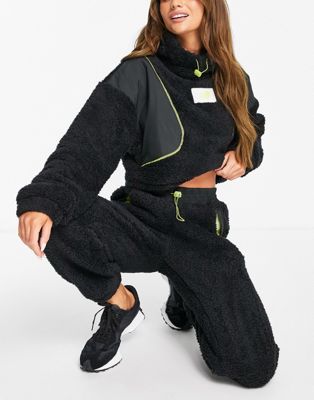 New Balance Achiever cropped borg hoodie in black exclusive to ASOS