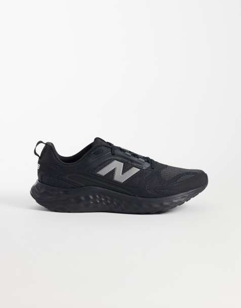 New Balance Arishi running trainers in black - view 1