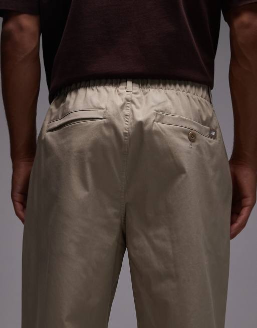 New Balance - Athletics - Ruimvallende broek in beige, 5 van 5