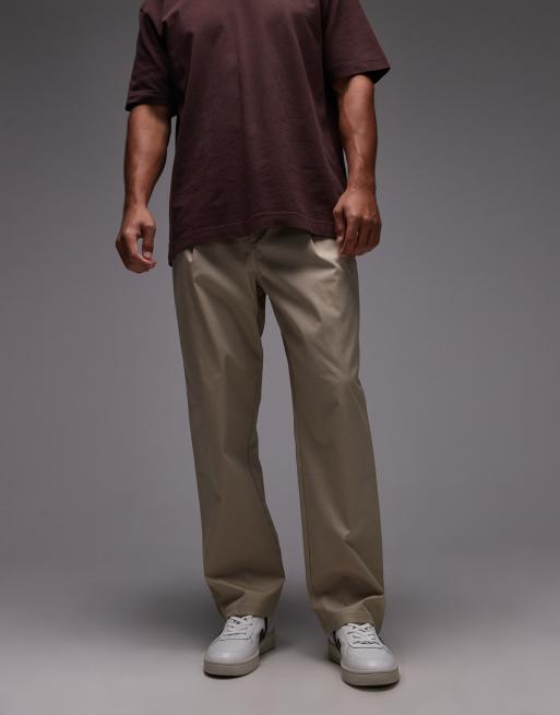 New Balance - Athletics - Ruimvallende broek in stoneware