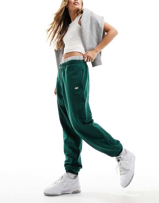 New Balance micro fleece joggers in green