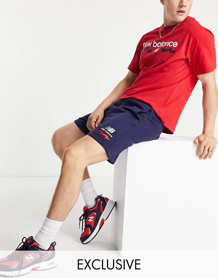 New Balance collegiate logo shorts in navy Exclusive to ASOS