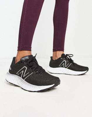 New Balance Evoz running trainers in black and white - ASOS Price Checker