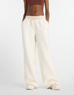 New Balance - Flauschige Fleece-Hose in Permafrost-Blau-Weiß