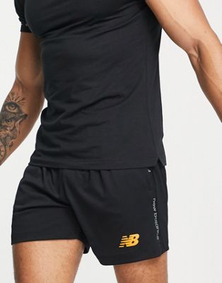 New Balance Football shorts in black and orange - exclusive to ASOS
