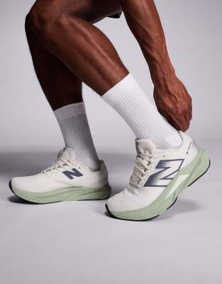 New Balance Fuelcell Propel running trainers in beige and green
