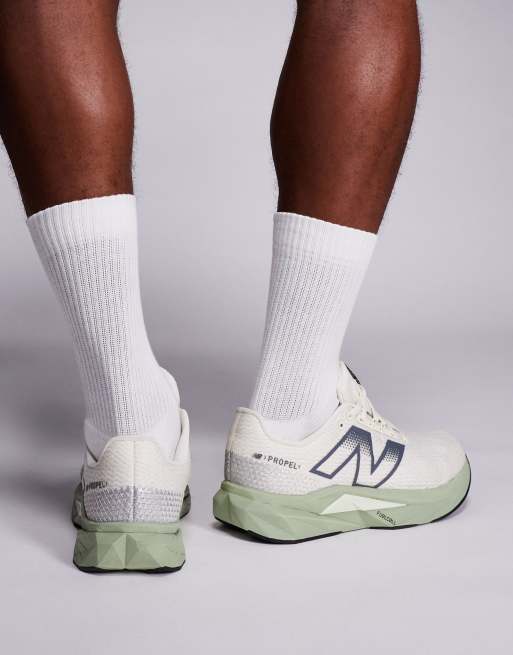 New Balance Fuelcell Propel running trainers in beige and green, 3 of 5