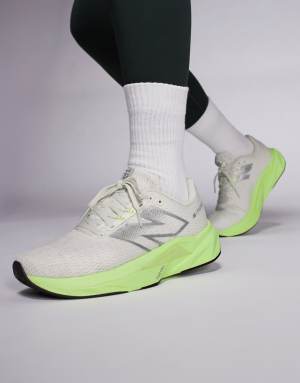 New Balance Fuelcell Propel running trainers in beige and neon yellow