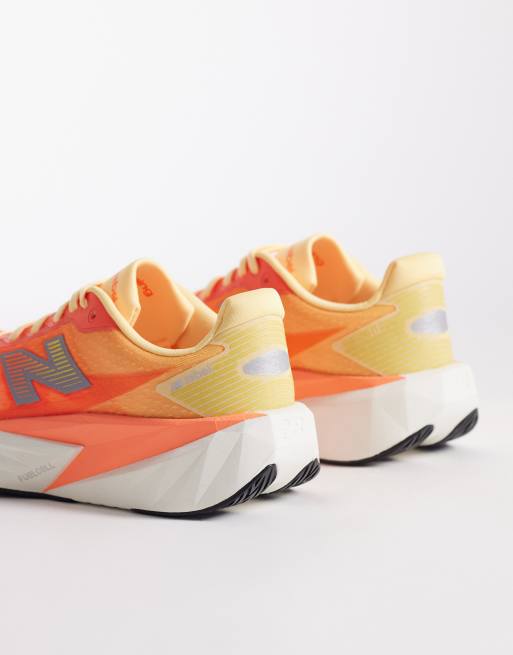 New Balance – Fuelcell Rebel v5 – Neonorange löparskor, 2 av 5