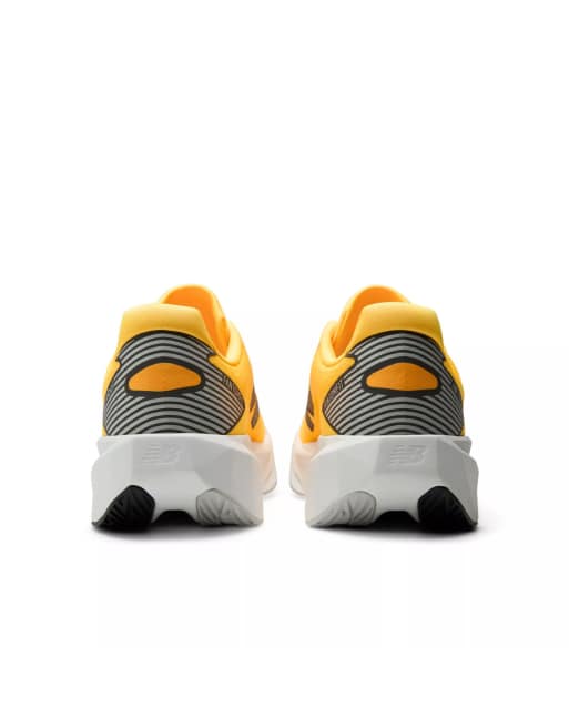 New Balance Fuelcell rebel v5 trainers in satsuma orange, 5 of 7