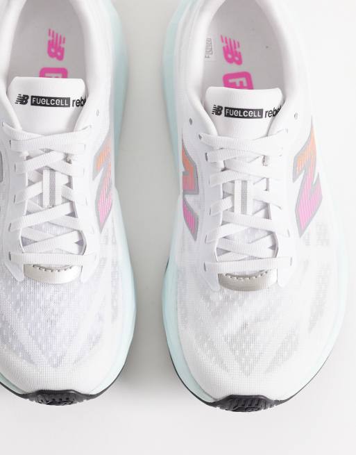 New Balance Fuelcell Rebel v5 womens running trainers in white, light blue and pink, 2 of 5