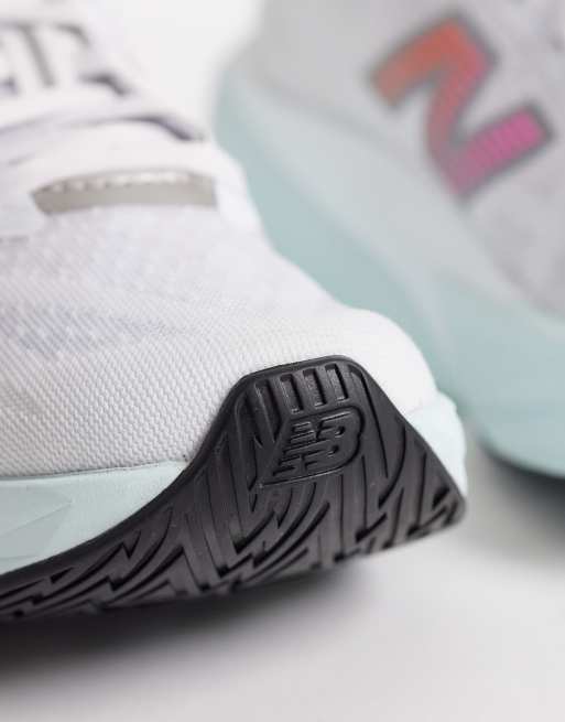 New Balance Fuelcell Rebel v5 womens running trainers in white, light blue and pink, 4 of 5