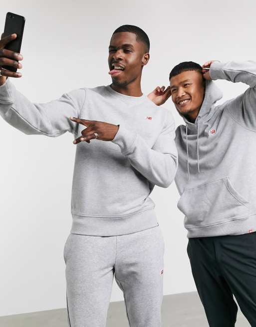 New Balance – Grå sweatshirt med liten logga
