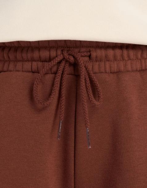 New Balance - Heritage - Pantaloni a fondo ampio in pile marrone con grafica lineare - view 1