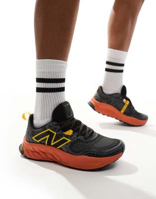 New Balance Hierro trail running trainers in black and orange