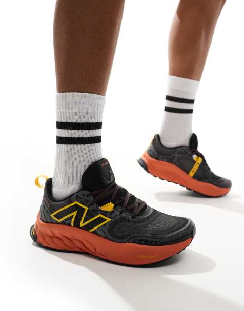 New Balance Hierro trail running trainers in black and orange - view 1