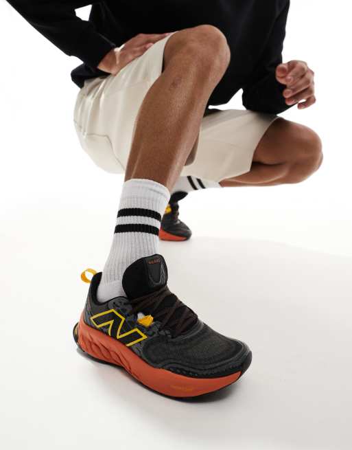 New Balance Hierro trail running trainers in black and orange, 3 of 5