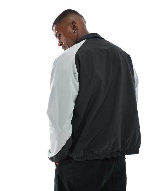 New Balance In game woven track jacket in black | ASOS