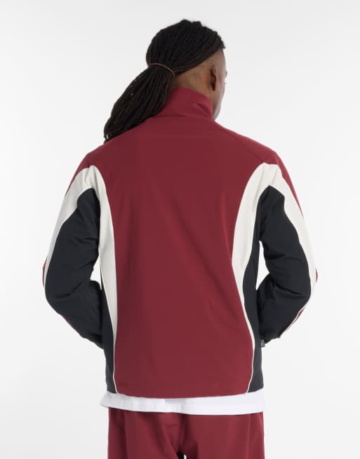 New Balance In Game woven track jacket in burgundy | ASOS