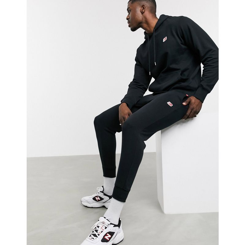 Activewear Pantaloni e leggings New Balance - Joggers neri con logo piccolo