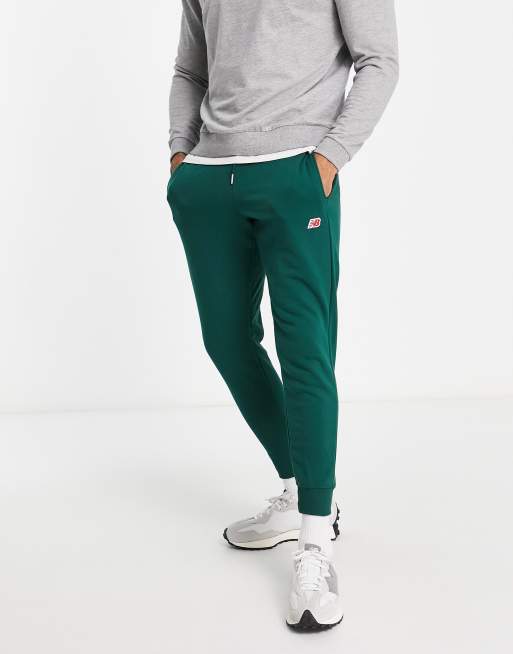 New Balance - Joggingbroek met klein logo in donkergroen