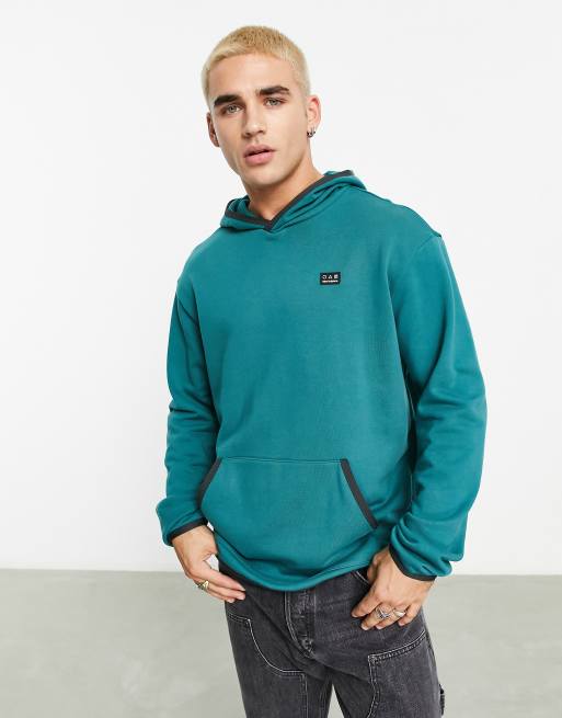 New Balance – Kapuzenpullover in Grün
