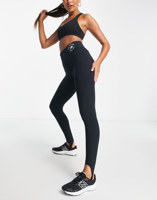 New Balance life in balance stirrup leggings in black Exclusive at ASOS