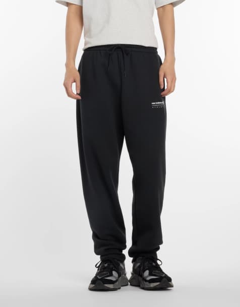 New Balance Linear graphic fleece pant in black