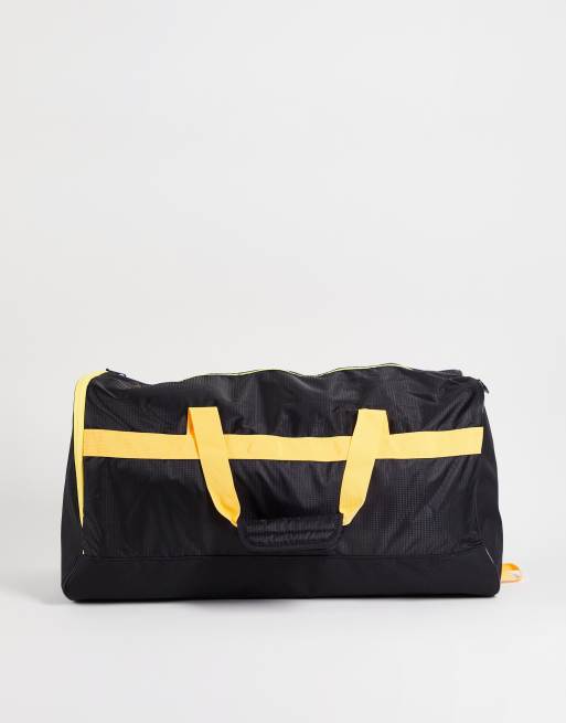 Black and yellow duffle bag on sale