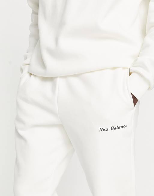 New Balance - Offwhite træningsbukser i unisex-stil med "Elevate Yourself"-grafik, 3 af 4