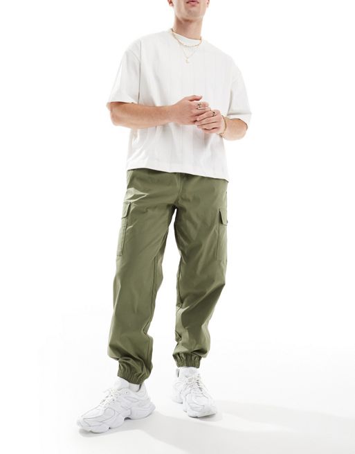 New Balance - Pantalon de jogging cargo en sergé - Vert