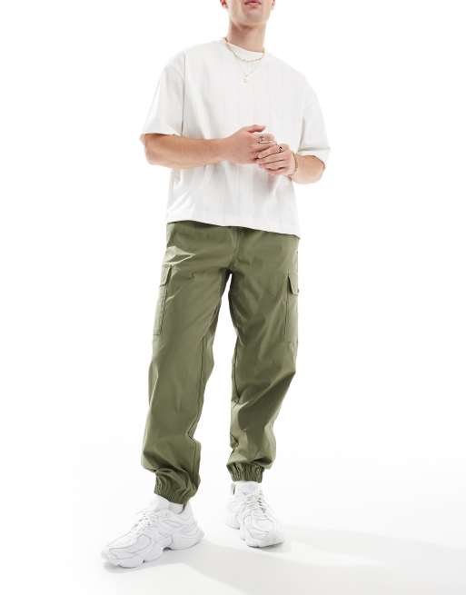 New Balance - Pantalon de jogging cargo en sergé - Vert