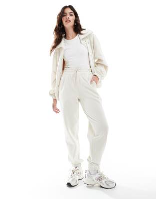 New Balance - Performance - Joggingbroek van fleece in beige
