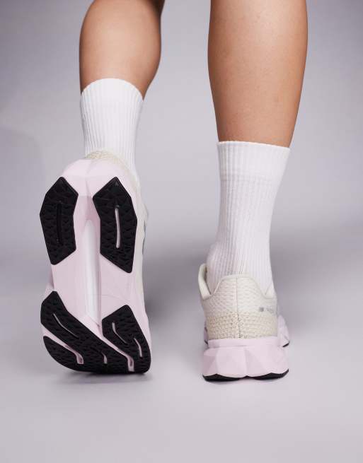 New Balance Propel running trainers in beige and pink ASOS