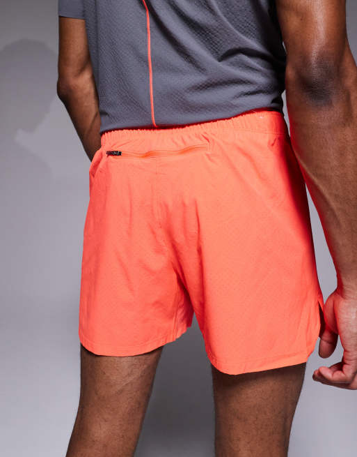 New Balance RC 5" shorts in red, 3 of 5