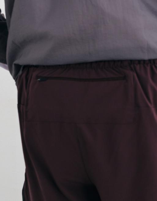 New Balance RC Essential Shorts 5 Zoll in Kirschleder, 3 von 5