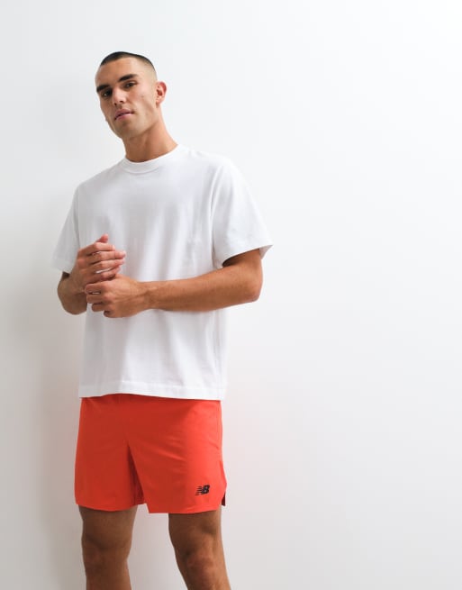 New Balance - RC - Pantalones cortos básicos con estampado naranja flamante, 3 de 5