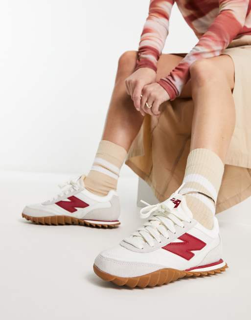 New Balance 574 trainers in white and burgundy