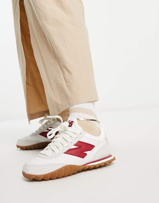 New Balance 574 trainers in white and burgundy