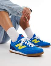 New Balance 1906 sneakers in white with blue and pink details