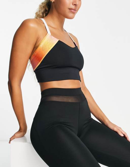 New Balance Relentless medium support sports bra in black - exclusive to  ASOS