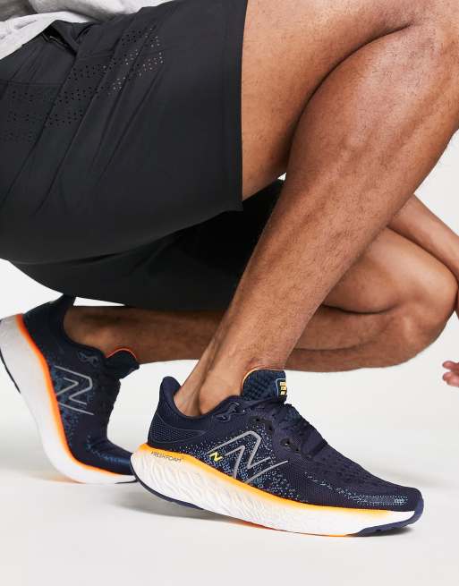 New Balance Running 1080 sneakers in navy and orange