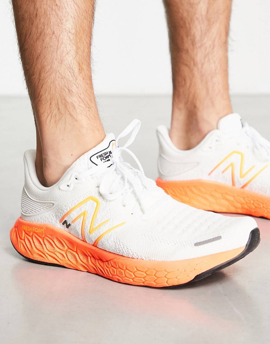 New Balance Running 1080 trainers in white and orange