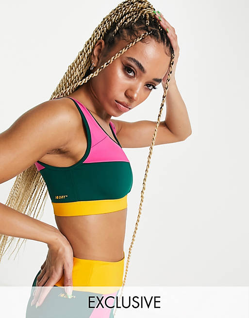 New Balance Running Achiever Remix colour block light support long line sports bra in pink exclusive to ASOS
