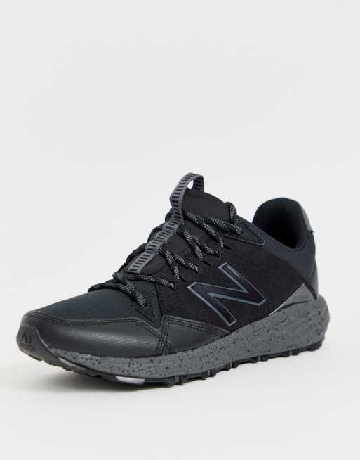 New Balance Running Crag trail trainers in black ASOS